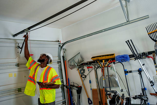 Professional Garage Door Panel Replacement technician working in Tompkins County County, NY